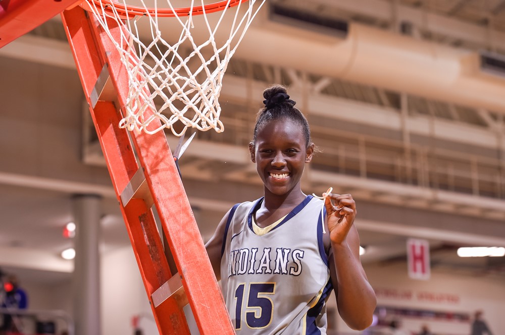 Womens basketball champion about to cut the net